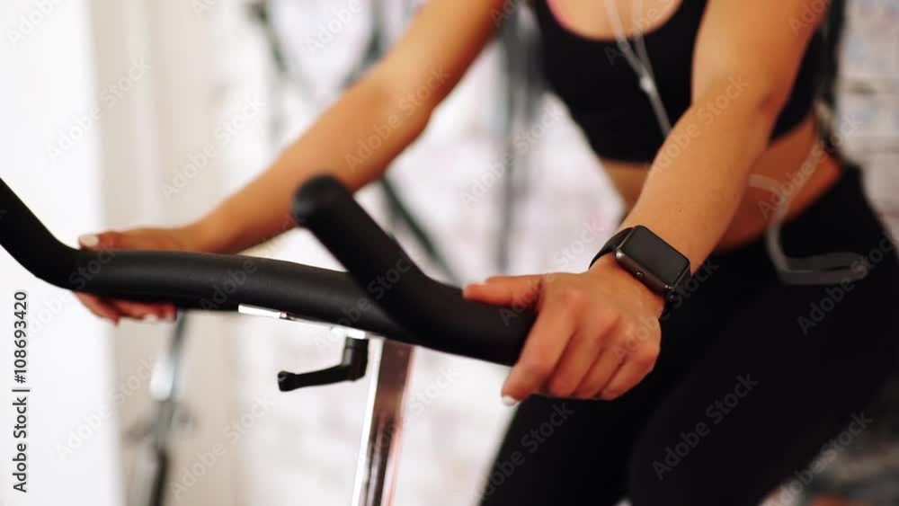 Smart watch showing a heart rate of exercising woman in gym Smart watch showing a heart rate of exercising woman in gym