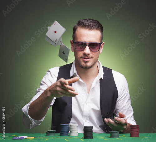 Obraz na płótnie Poker player throwing cards at the table