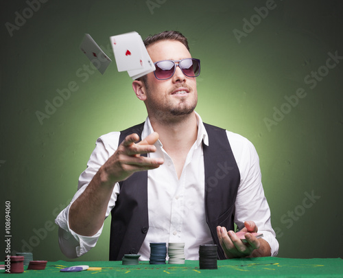 Obraz na płótnie Poker player throwing cards at the table
