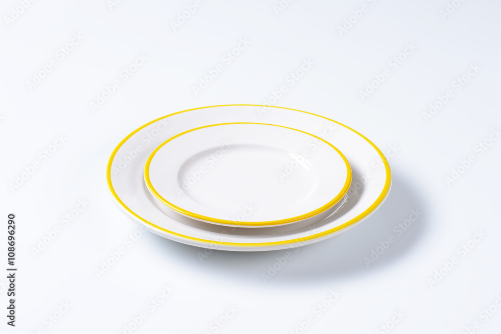Yellow and white dinner plates Yellow and white dinner plates