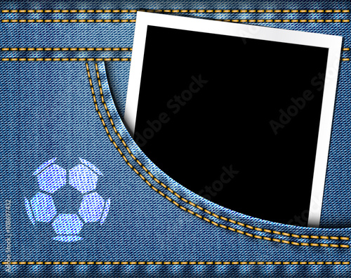 Soccer ball on jeans and blank photo frame in blue jeans pocket