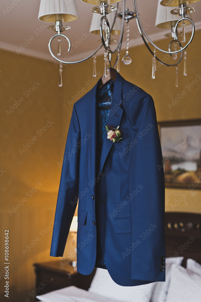 Mens suit hanging on the chandelier 5937.