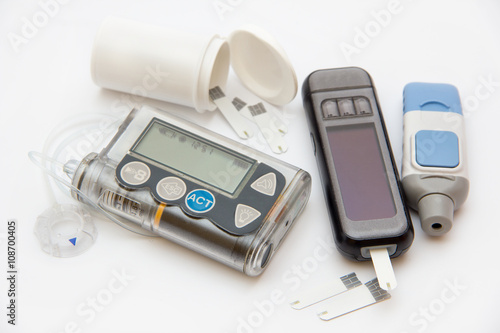 Accessories you need to control diabetes- insulin pump and blood sugar meter photo