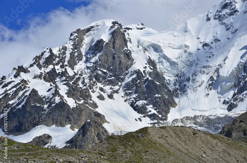 Snow peak and a large cloud