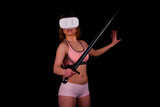 Woman with sword playing in the virtual reality video game
