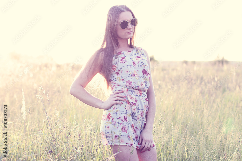 Beautiful girl field green meadow in summer park delicate dress, enjoying leisure, fashion style, glamor life, student at a bright sunny day. Beautiful girl field green meadow in summer park delicate dress, enjoying leisure, fashion style, glamor life, student at a bright sunny day.