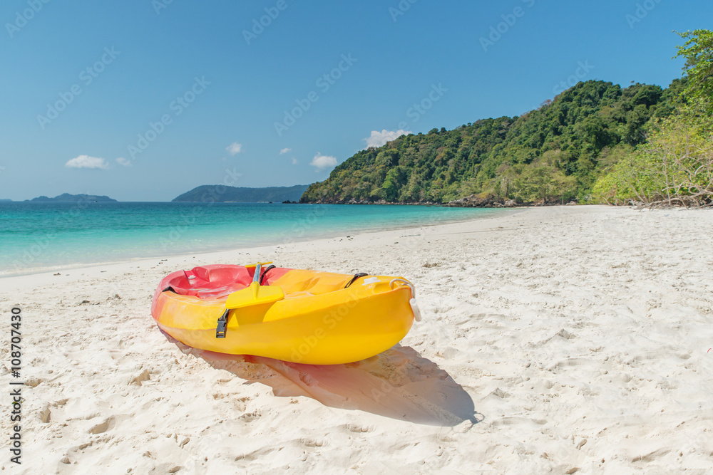 Summer, Travel, Vacation and Holiday concept - Colorful kayaks o Summer, Travel, Vacation and Holiday concept - Colorful kayaks o