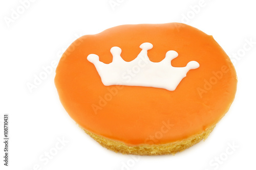 Traditional Dutch pastry with a crown especially produced for King's day on april 27th in Holland on a white background