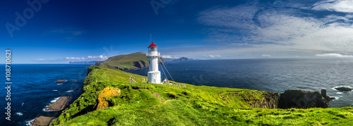 Fotografie, Tablou Panoramic view of Old lighthouse on the beautiful island Mykines.