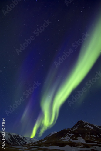 Northern Lights above mountains edge