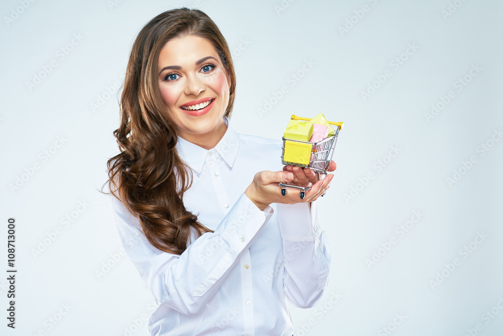 Smiling woman hold market card with gifts box. Smiling woman hold market card with gifts box.