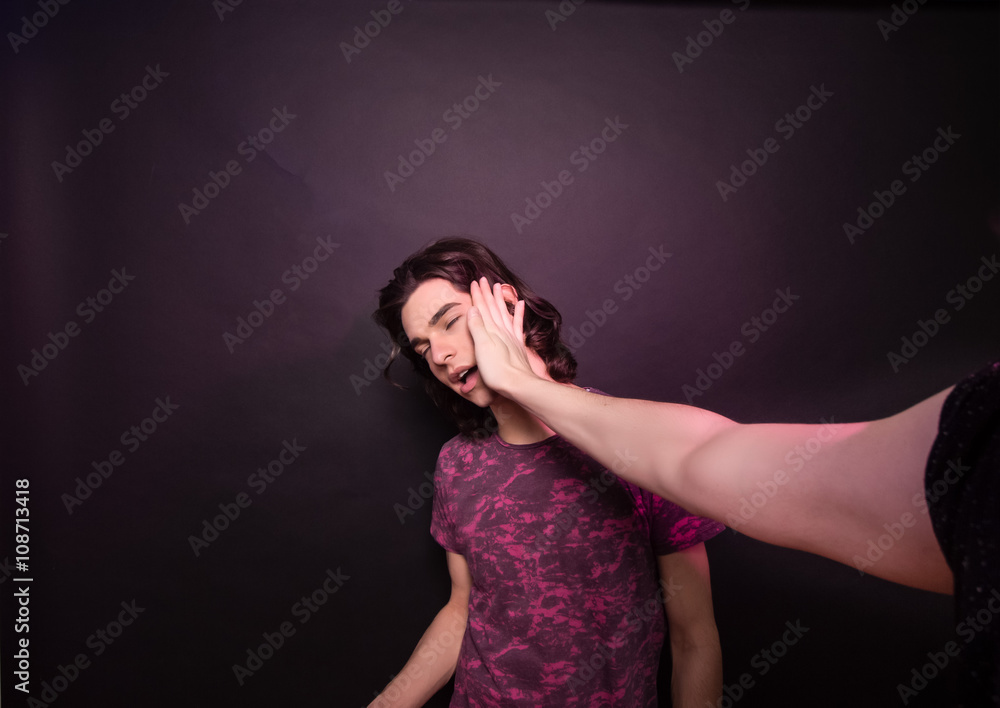 One hand hitting other man face. One hand hitting other man face.
