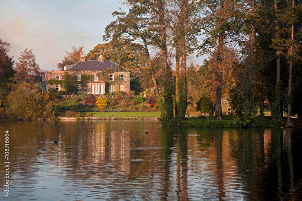 House Across the Lake at Sunset