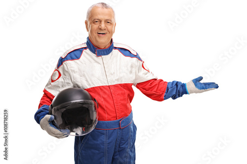 Mature car racer gesturing with his hand