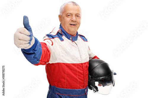 Mature car racer giving a thumb up