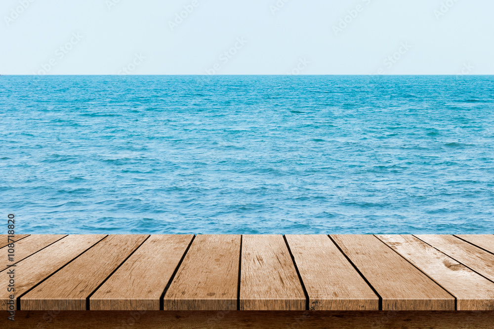 wood table top with blue sea background wood table top with blue sea background