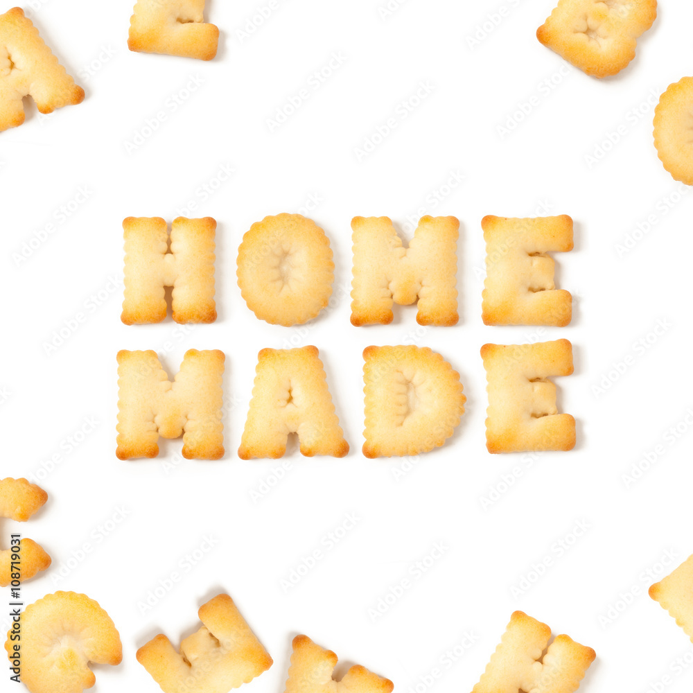 home made message written with homemade biscuits, on white background