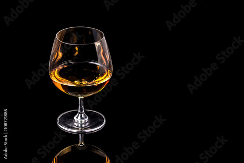 Goblet of Brandy on the black background