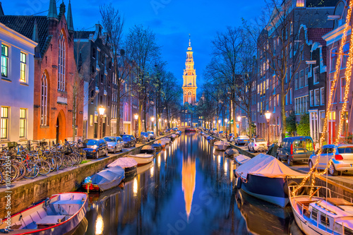 Amsterdam canals with bridge and typical dutch houses in Netherl