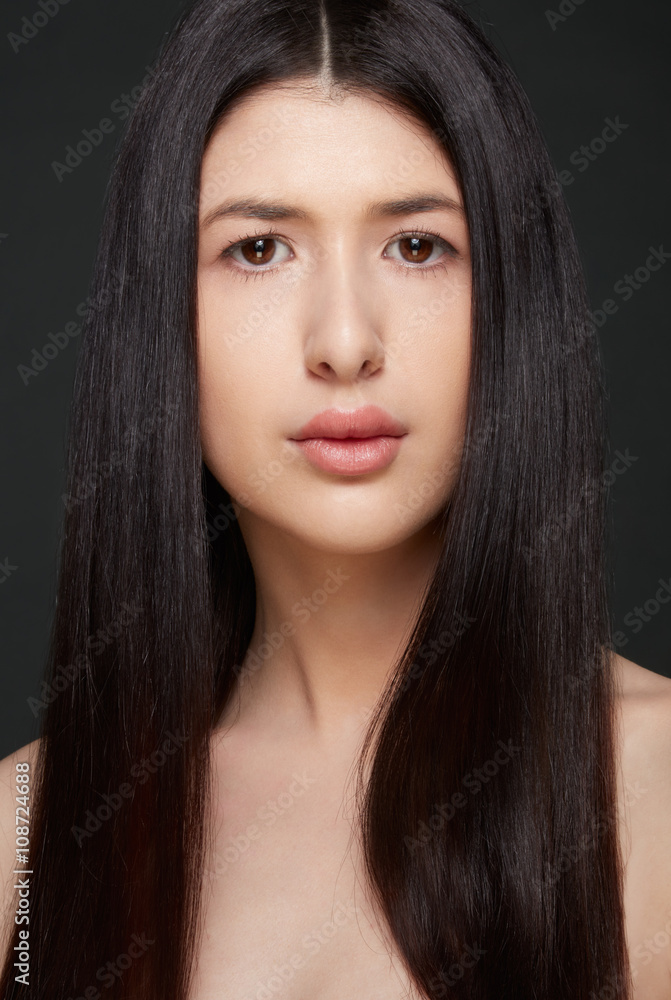 Young woman beauty with natural make up and dark straight hair Young woman beauty with natural make up and dark straight hair