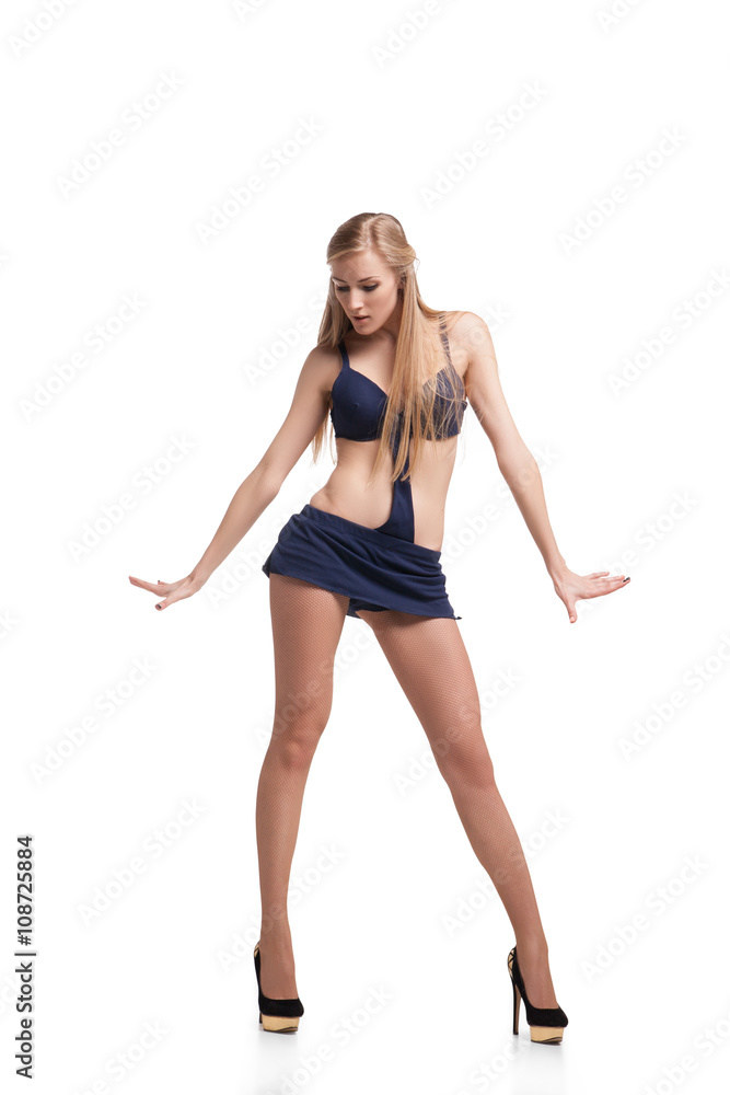 Young beautiful dancer posing on studio background Young beautiful dancer posing on studio background