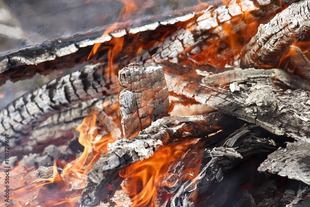 bright red tongues of flame and glowing white-hot coals bright red tongues of flame and glowing white-hot coals