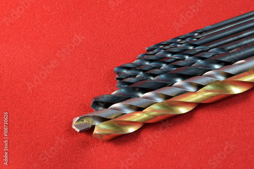 Close up different kinds and number of Metal drill bits photo