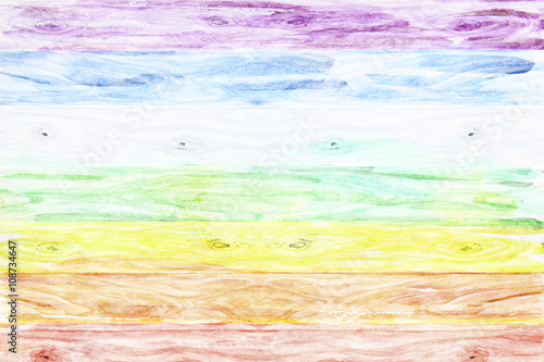 Rural wooden background colored like a rainbow with space for yo