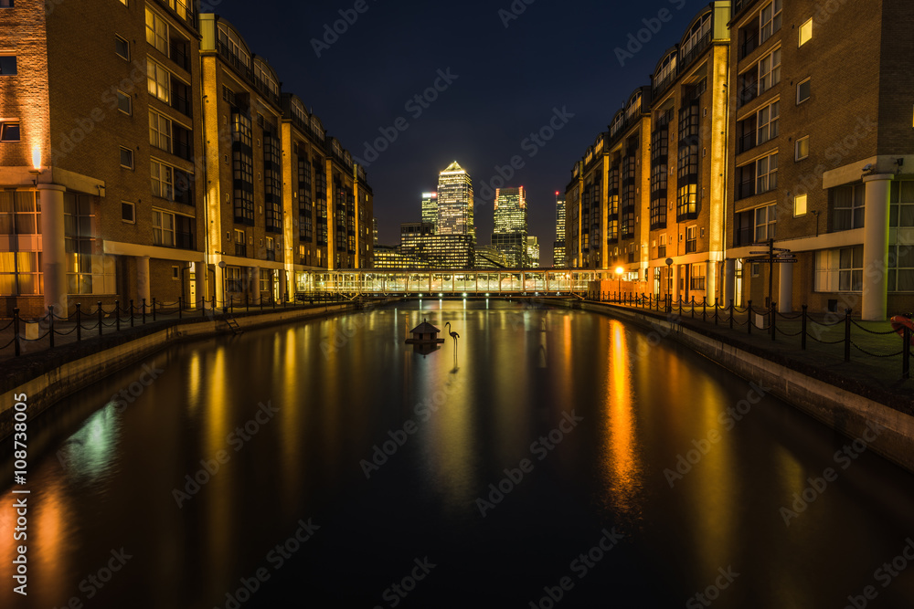Cityscape of Canary Wharf London financial sky scrapers at night