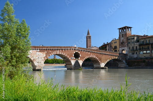 Ponte Pietra on river Adige, ancient roman bridge in the old town of Verona, Italy 