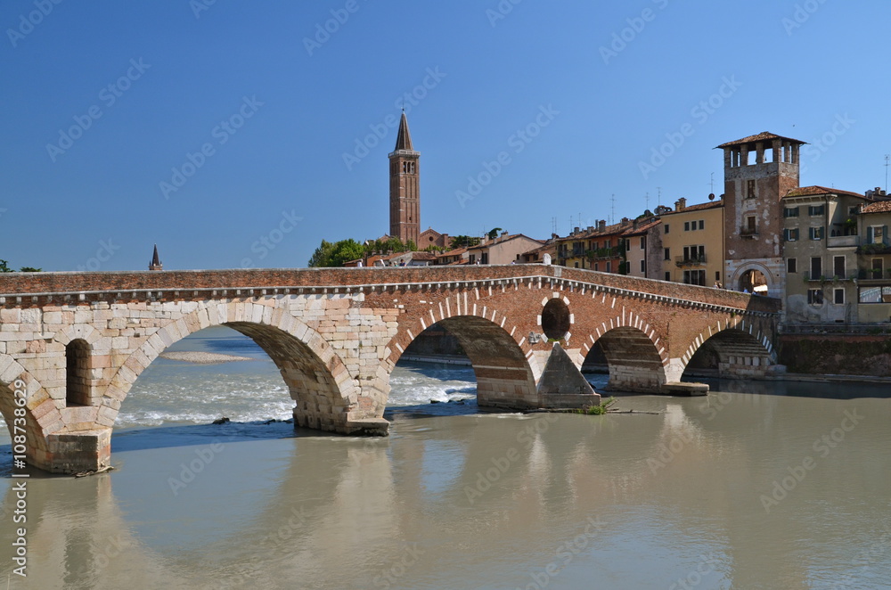 Ponte Pietra on river Adige, ancient roman bridge in the old town of Verona, Italy