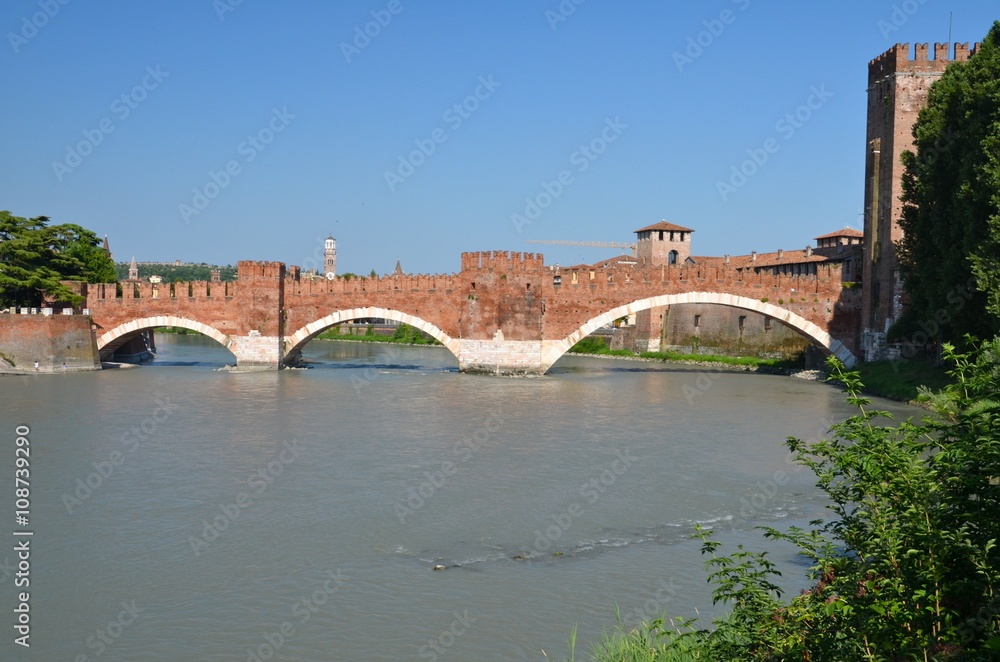 Naklejka premium Medieval stone bridge Ponte Scaligero across the river Adige and tower of Castelvecchio, Verona, Northern Italy. 
