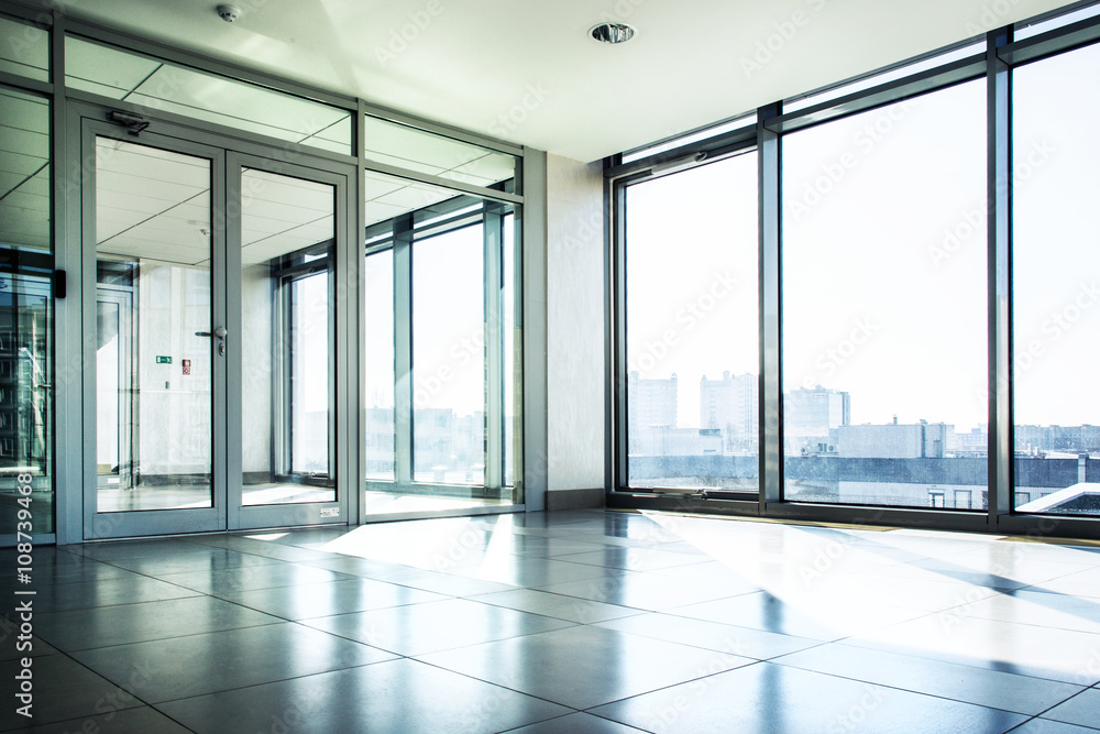 Office with glass wall and sunny weather Office with glass wall and sunny weather