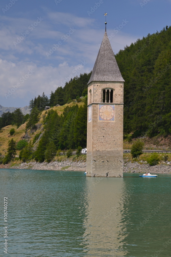 The old church tower of Reschen (Resia) in the reservoir Lake Reschen (lago di Resia),  Italy