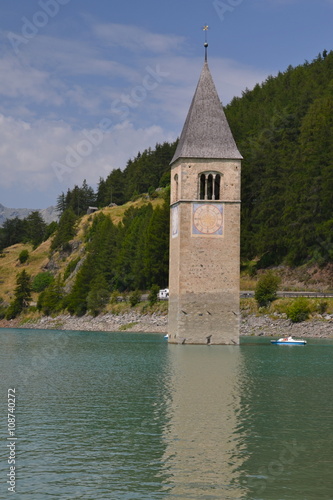 The old church tower of Reschen (Resia) in the reservoir Lake Reschen (lago di Resia),  Italy