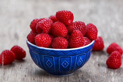 Fresh raspberries in bowl. concept for healthy eating.