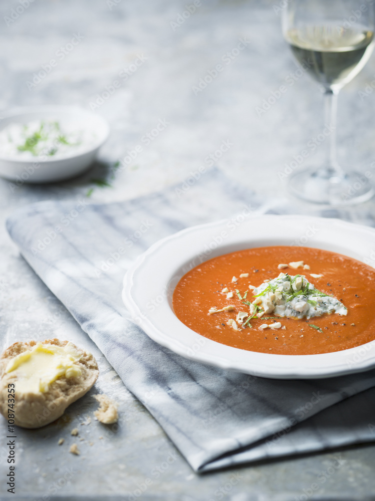 Soup on table with bread roll and wine Soup on table with bread roll and wine