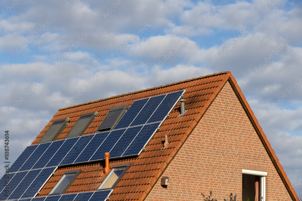 house with solar power and panels on the roof house with solar power and panels on the roof