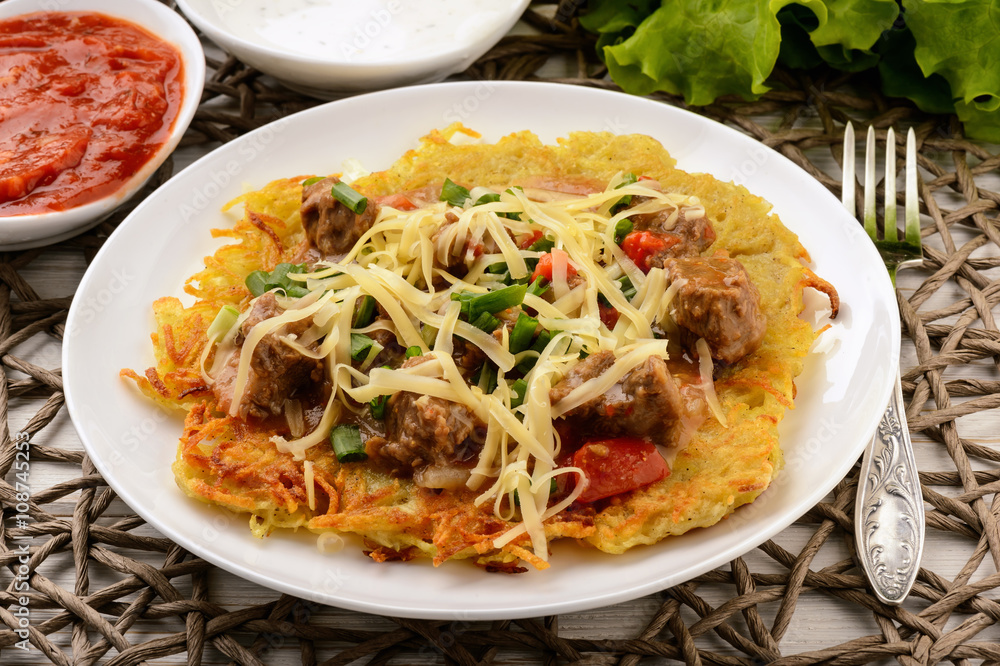 Potato pancake with goulash. Potato pancake with goulash.