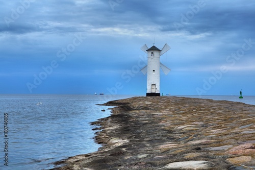 Wallpaper Mural Lighthouse windmill Stawa Mlyny in Swinoujscie, Baltic Sea, Poland. Torontodigital.ca