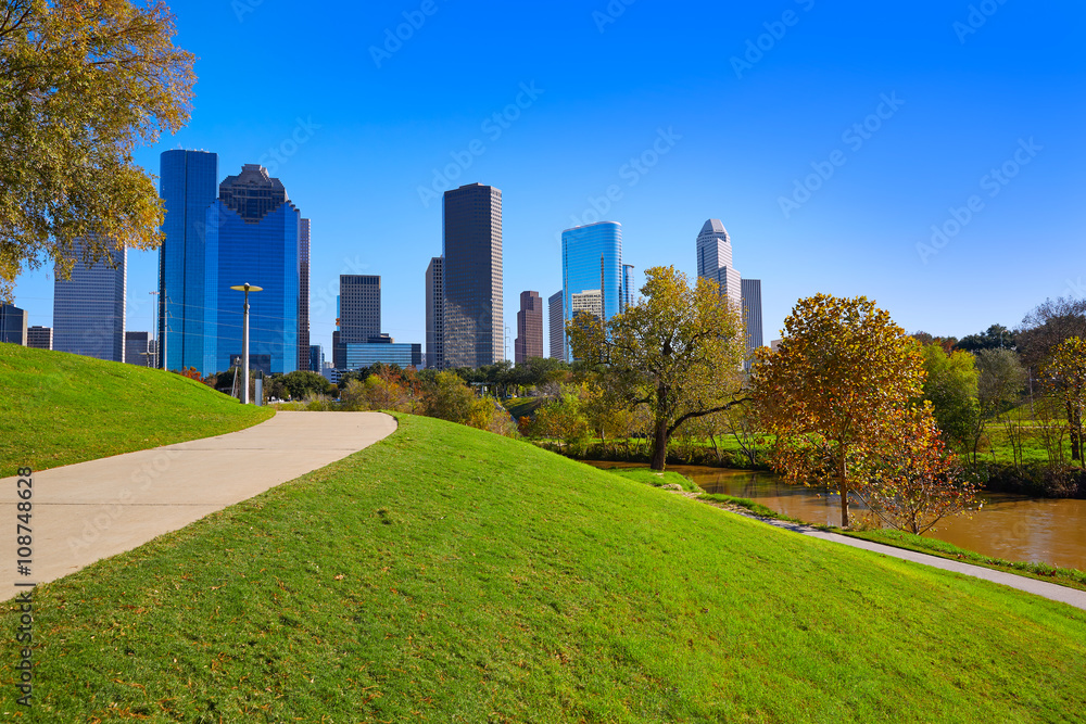 Houston skyline in sunny day from park grass