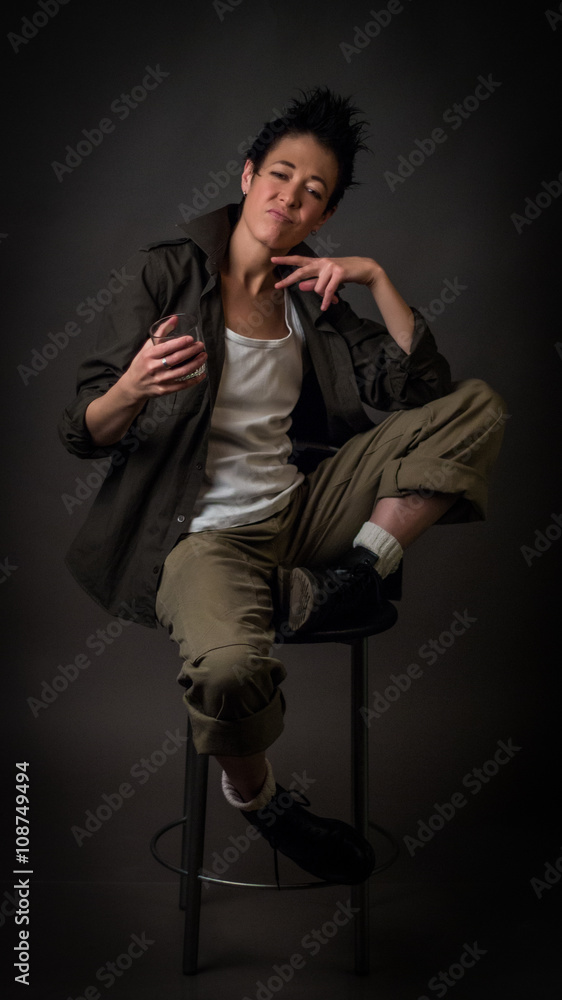 Androgynous character on a gray background. Man or woman. Military style. Androgynous character on a gray background. Man or woman. Military style.