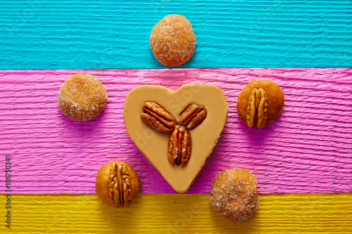 Mexican candy sweets cajeta heart with pecan photo