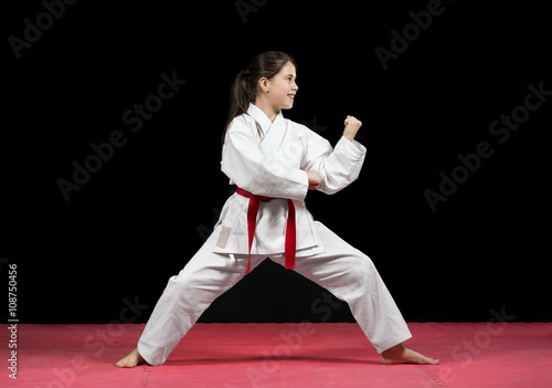 Young girl preforming karate martial arts