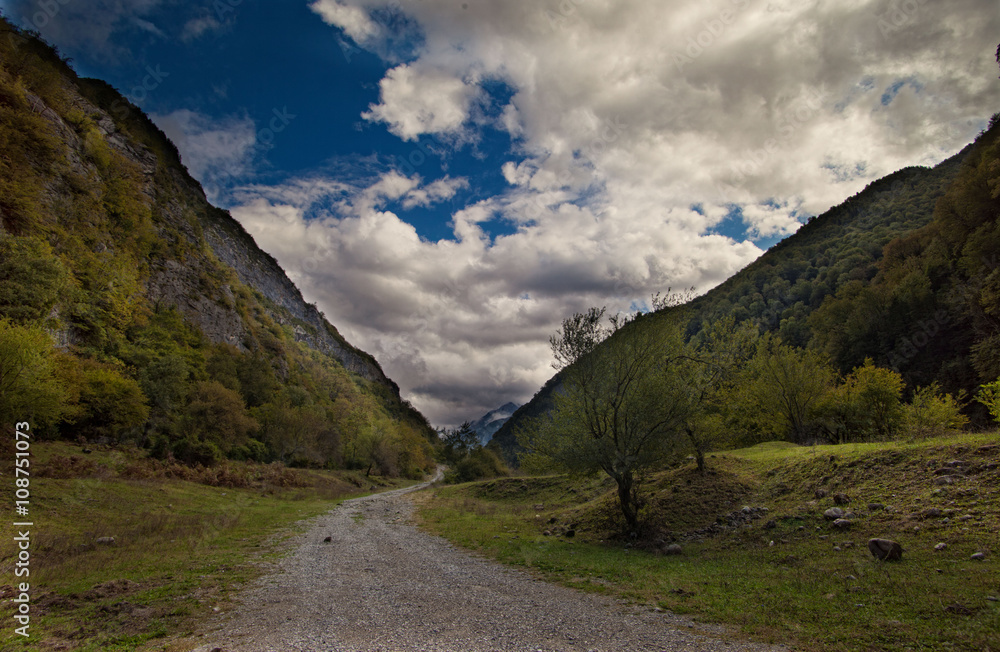 mountains valley in summer afternoon with gentle clouds mountains valley in summer afternoon with gentle clouds