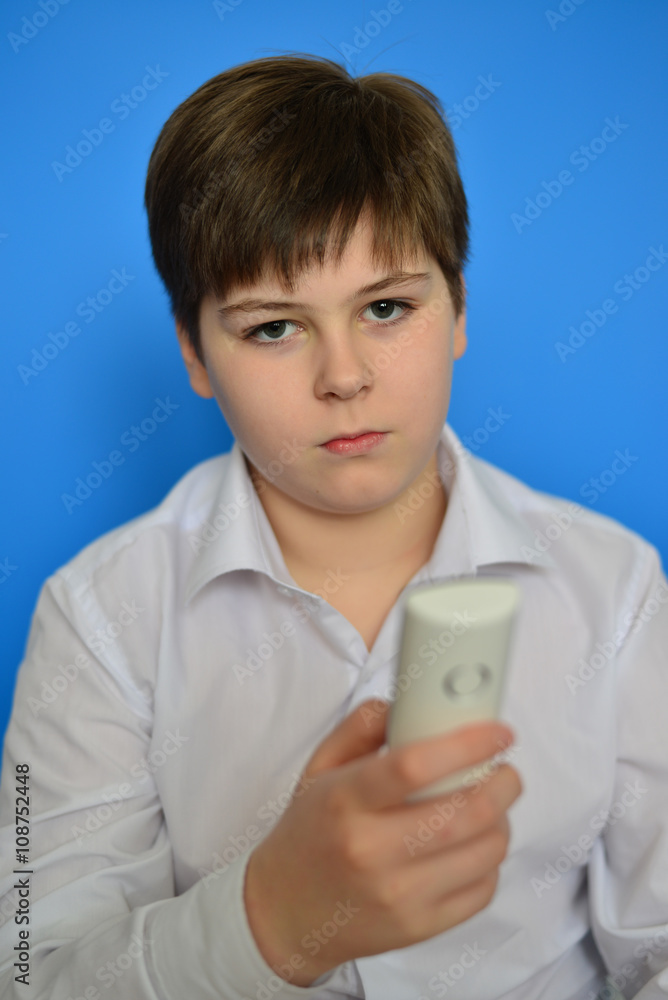 Boy teenager dials the number on radiotelephone Boy teenager dials the number on radiotelephone