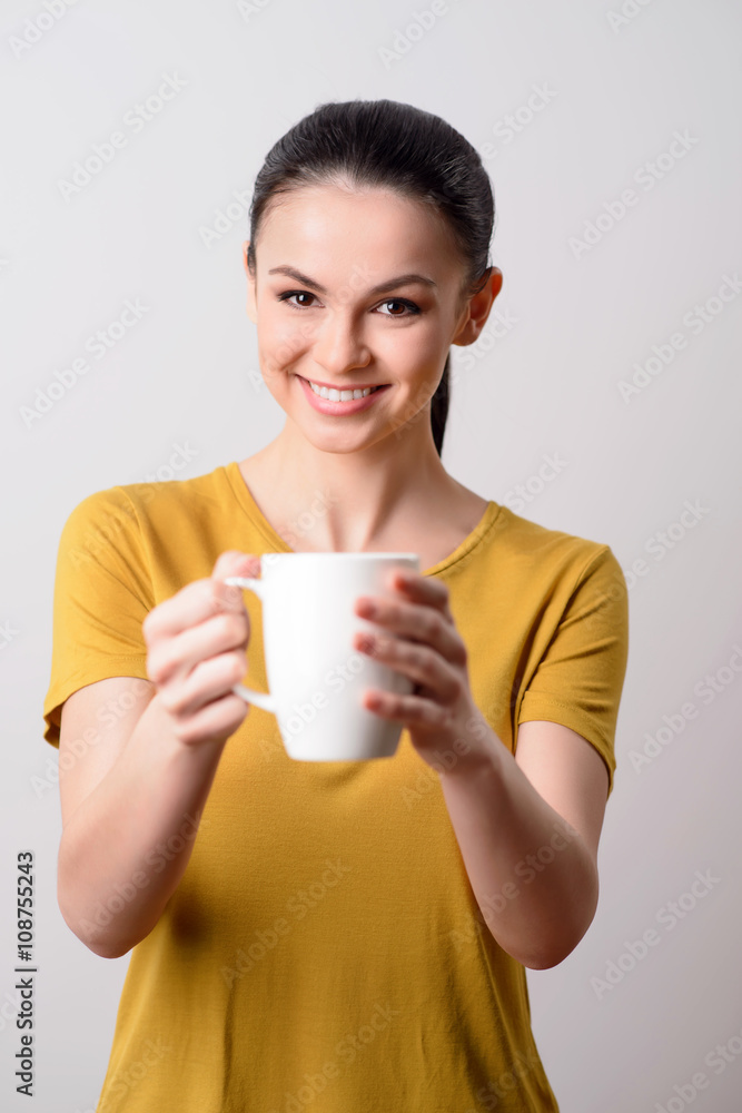 Nice girl giving you a cup of coffee Nice girl giving you a cup of coffee