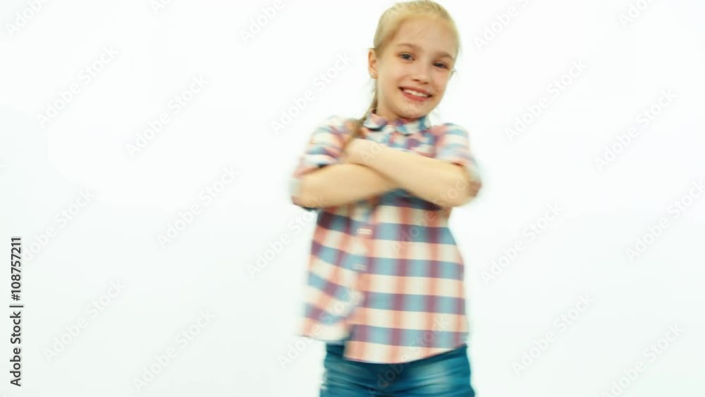 Portrait girl dancing on the white background and smiling at camera Portrait girl dancing on the white background and smiling at camera