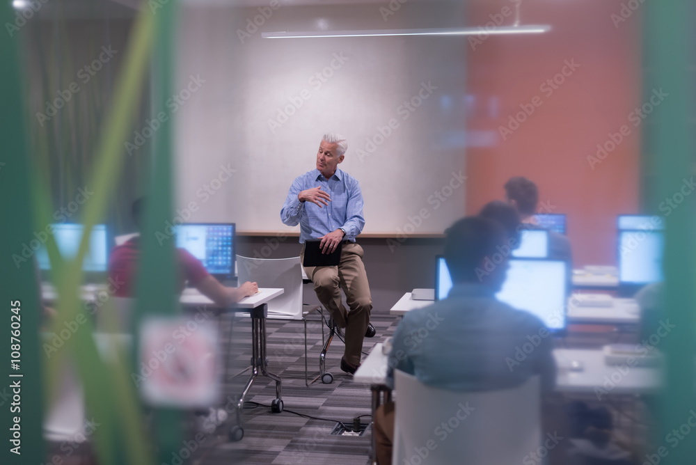 teacher and students in computer lab classroom