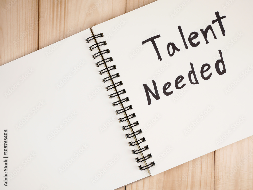 Handwriting Talent Needed on colorful note paper and notebook with wood background. Handwriting Talent Needed on colorful note paper and notebook with wood background.